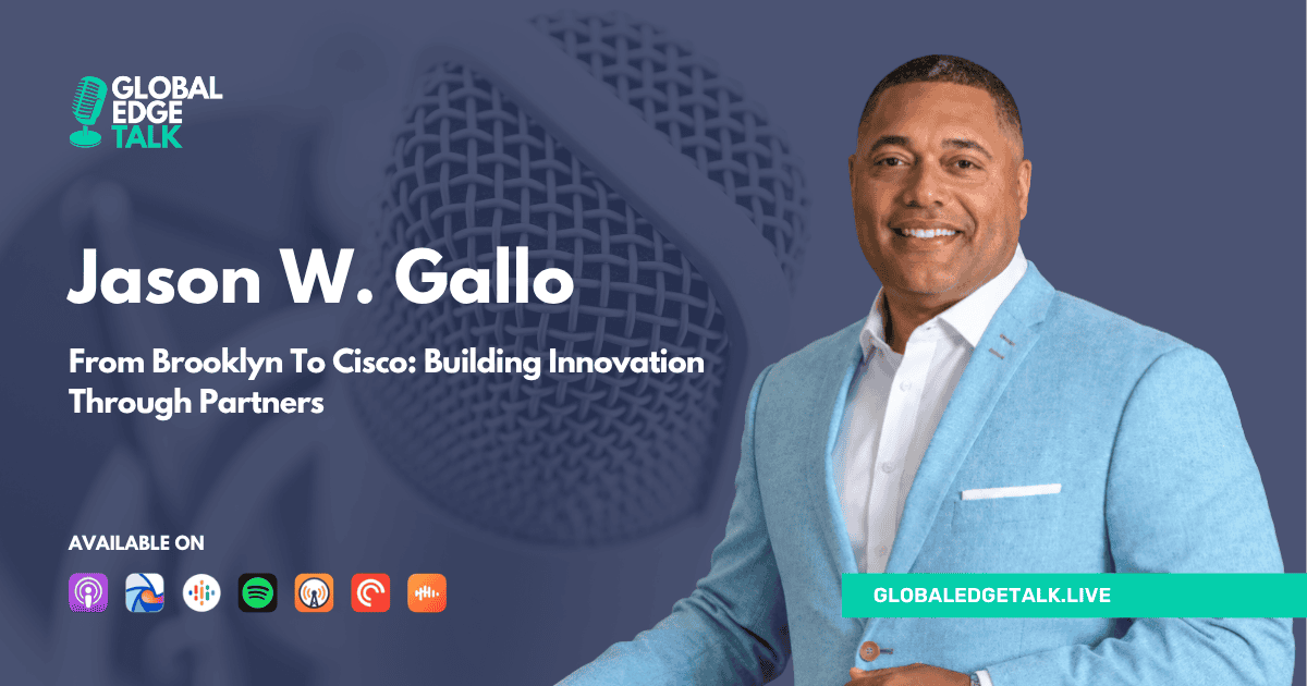 Jason W. Gallo smiling in a blue suit at Global Edge Talk event.
